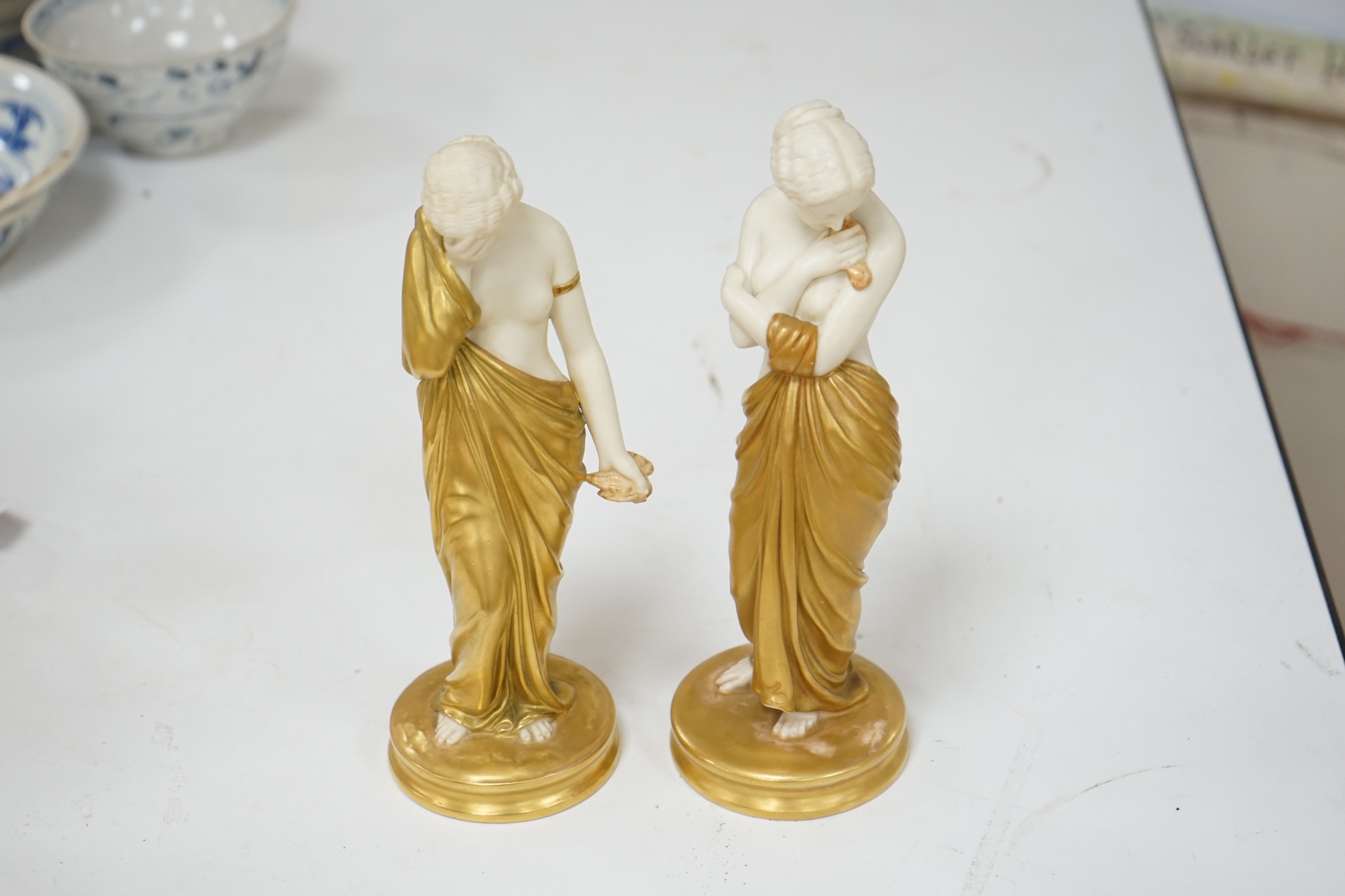 A pair of Royal Worcester porcelain figures, Joy and Sorrow, modelled by James Hadley, 2/57 & 2/47, 24cm. Condition - good